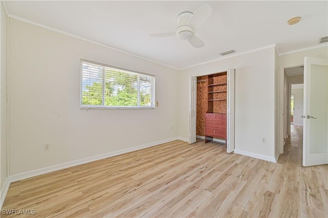 unfurnished bedroom featuring crown molding, ceiling fan, and light wood-type flooring