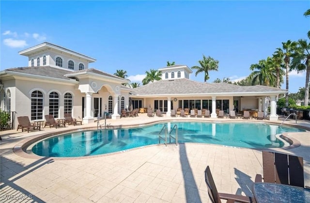 view of swimming pool with a patio