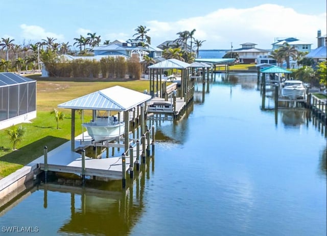 view of dock featuring a water view, a yard, and glass enclosure