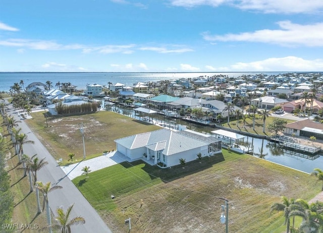 drone / aerial view with a water view