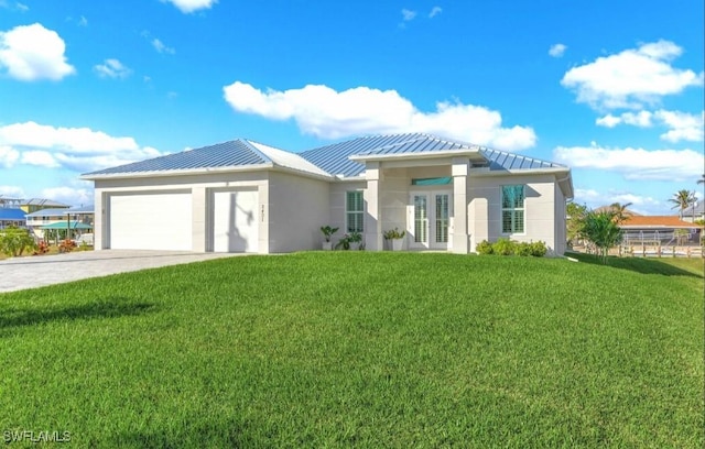 view of front of property with a garage and a front yard