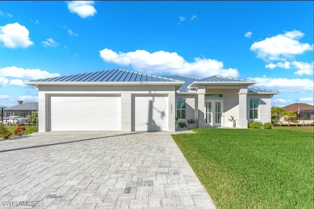 view of front facade featuring a garage and a front yard