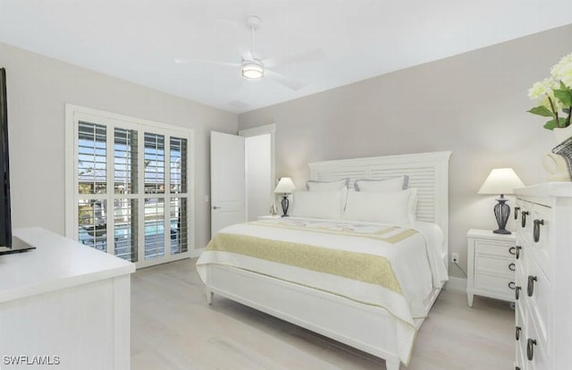 bedroom with ceiling fan and light hardwood / wood-style floors