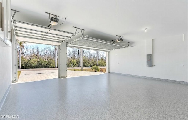 garage featuring a garage door opener and electric panel