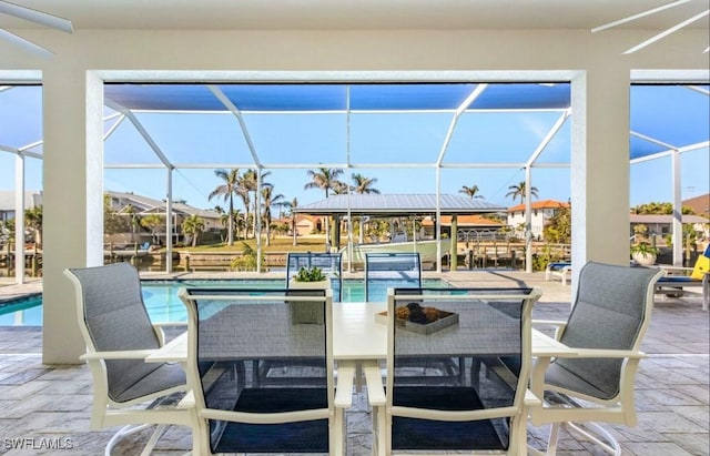 view of patio / terrace featuring glass enclosure