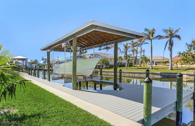 dock area with a water view and a yard