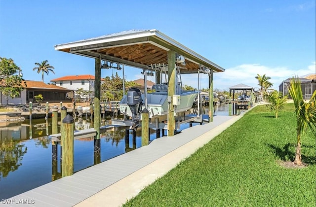 dock area with a water view and a lawn