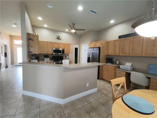 kitchen with light tile patterned floors, ceiling fan, stainless steel appliances, light brown cabinetry, and kitchen peninsula