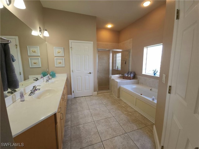 bathroom featuring vanity, tile patterned floors, and plus walk in shower