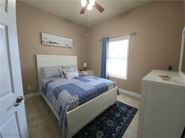 bedroom featuring light tile patterned flooring and ceiling fan