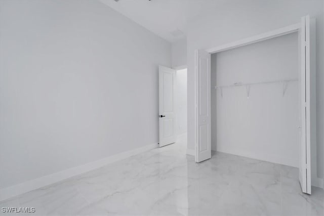 unfurnished bedroom with a closet