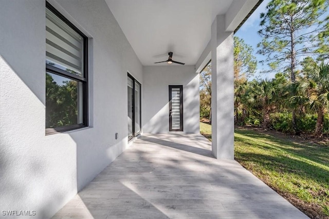 view of patio / terrace featuring ceiling fan