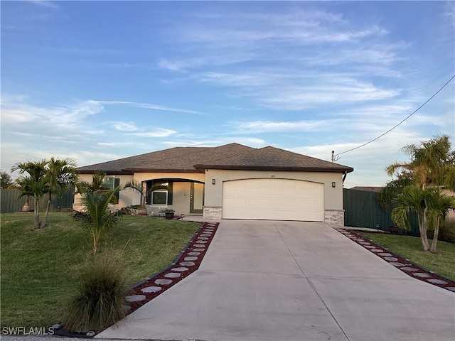 view of front of house featuring a garage and a front yard