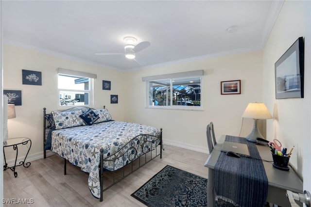 bedroom with crown molding, ceiling fan, and light hardwood / wood-style flooring