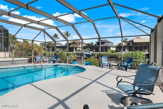 view of pool with a lanai and a patio