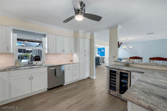 kitchen with wine cooler, dishwasher, light wood-type flooring, and white cabinets