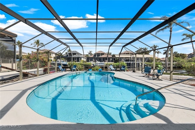 view of pool featuring a lanai and a patio area