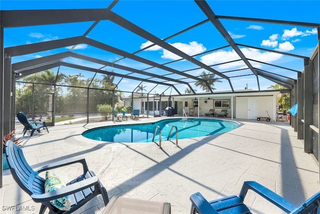 view of pool featuring a lanai and a patio