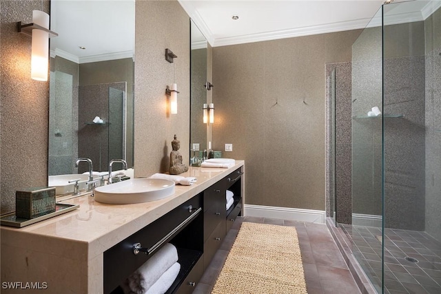 bathroom featuring tile patterned flooring, ornamental molding, a shower with door, and vanity