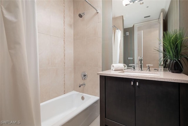 bathroom with shower / tub combo with curtain and vanity