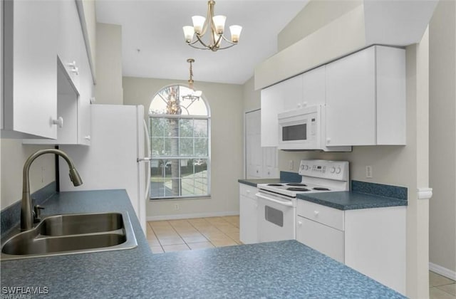 kitchen with sink, a notable chandelier, pendant lighting, white appliances, and white cabinets