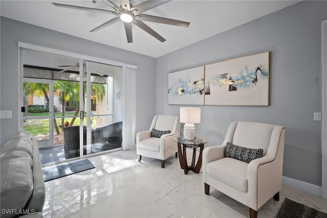 living area featuring ceiling fan