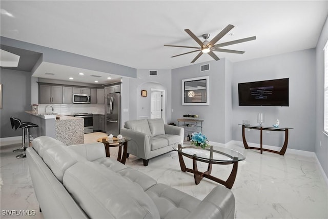 living room featuring ceiling fan