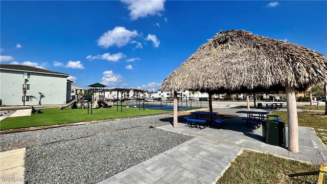 surrounding community with a playground, a gazebo, and a yard