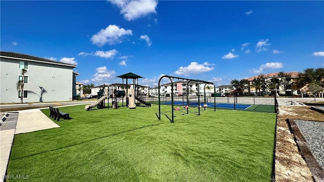 view of playground featuring a lawn