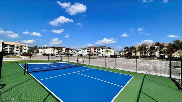 view of tennis court featuring basketball court