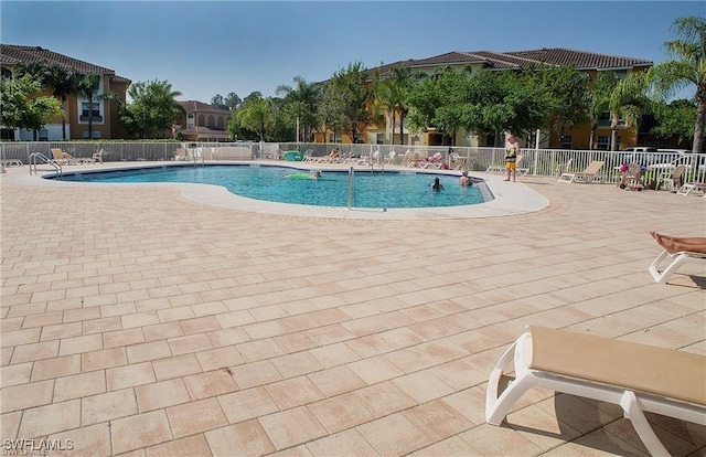 view of swimming pool with a patio area