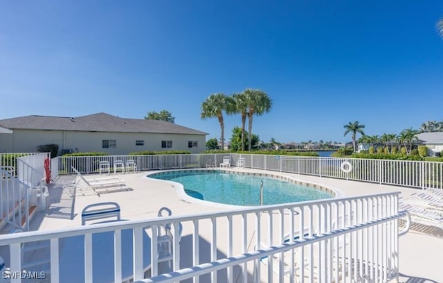 view of swimming pool featuring a patio area