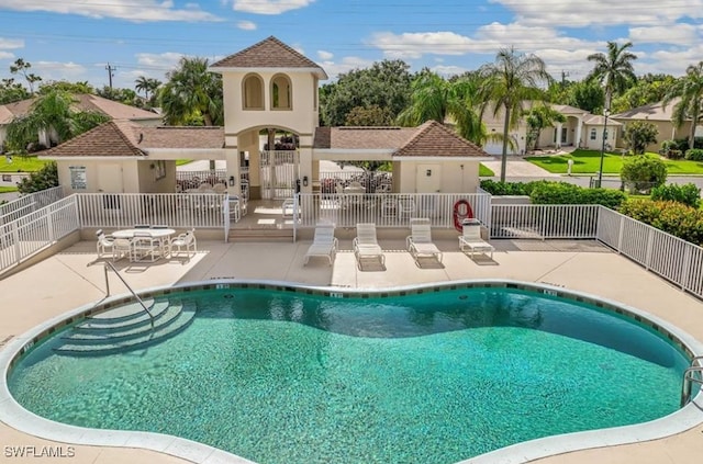 view of swimming pool with a patio