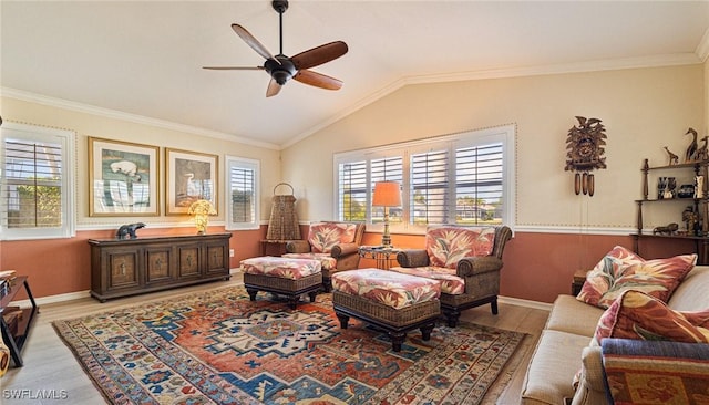 living room with a ceiling fan, baseboards, vaulted ceiling, ornamental molding, and light wood finished floors