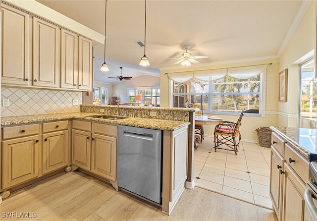 kitchen featuring tasteful backsplash, sink, stainless steel dishwasher, and kitchen peninsula