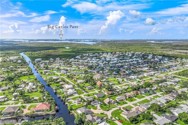 birds eye view of property featuring a water view and a residential view