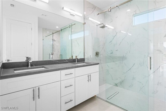 bathroom with vanity and walk in shower