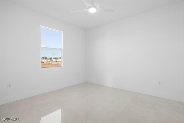 unfurnished room with ceiling fan