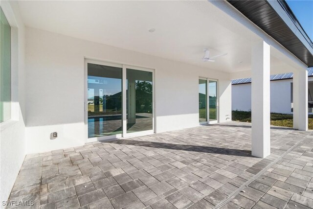 view of patio featuring ceiling fan