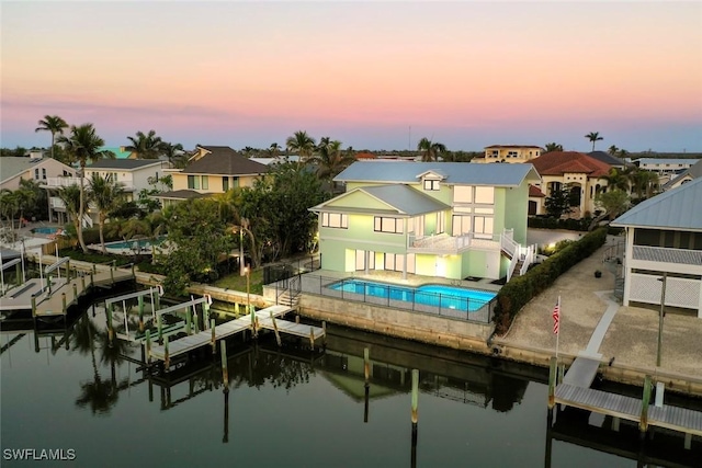 exterior space with a patio and a water view