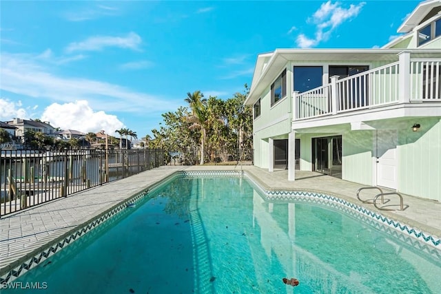 view of swimming pool with a water view