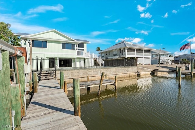 dock area with a water view