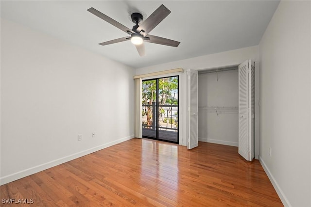 unfurnished bedroom with ceiling fan, access to exterior, light hardwood / wood-style floors, and a closet