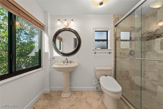 full bath with tile patterned flooring, toilet, baseboards, and a shower stall