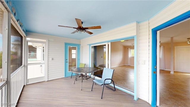 sunroom / solarium with ceiling fan and plenty of natural light