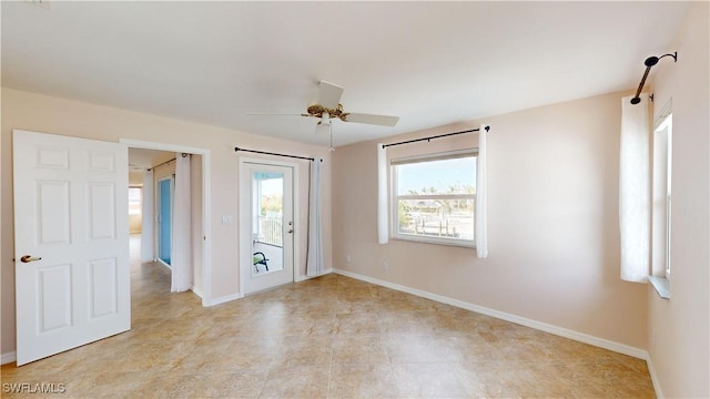 unfurnished room with ceiling fan