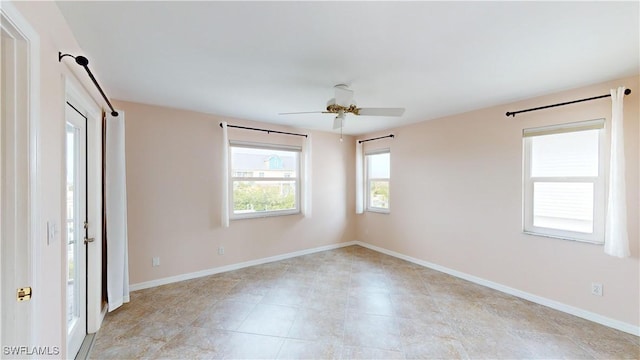 spare room with ceiling fan