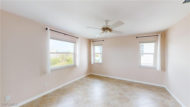 spare room with ceiling fan