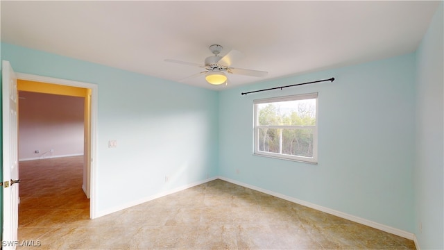 spare room with ceiling fan