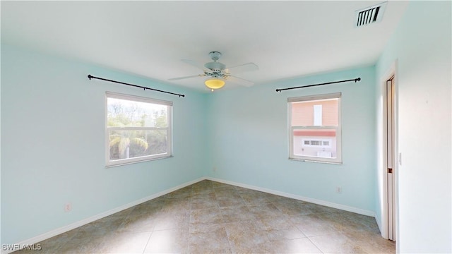 unfurnished room featuring ceiling fan